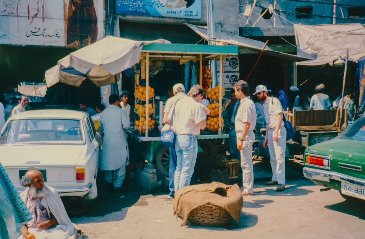 People shop at an outdoor market.