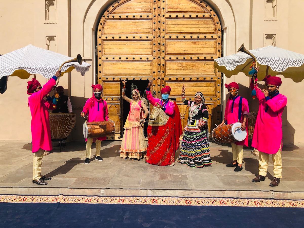 people in traditional dress dancing on street during daytime