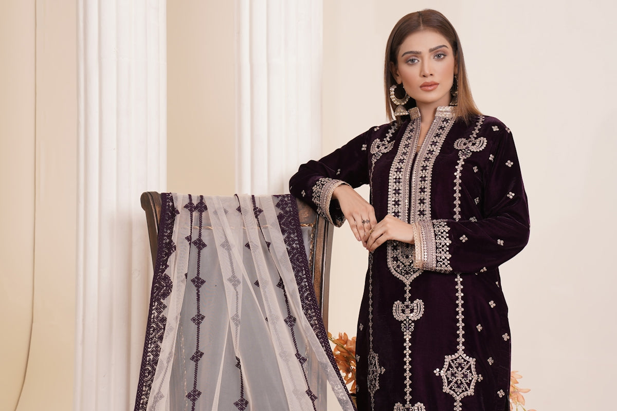 a woman standing next to a curtain in a room