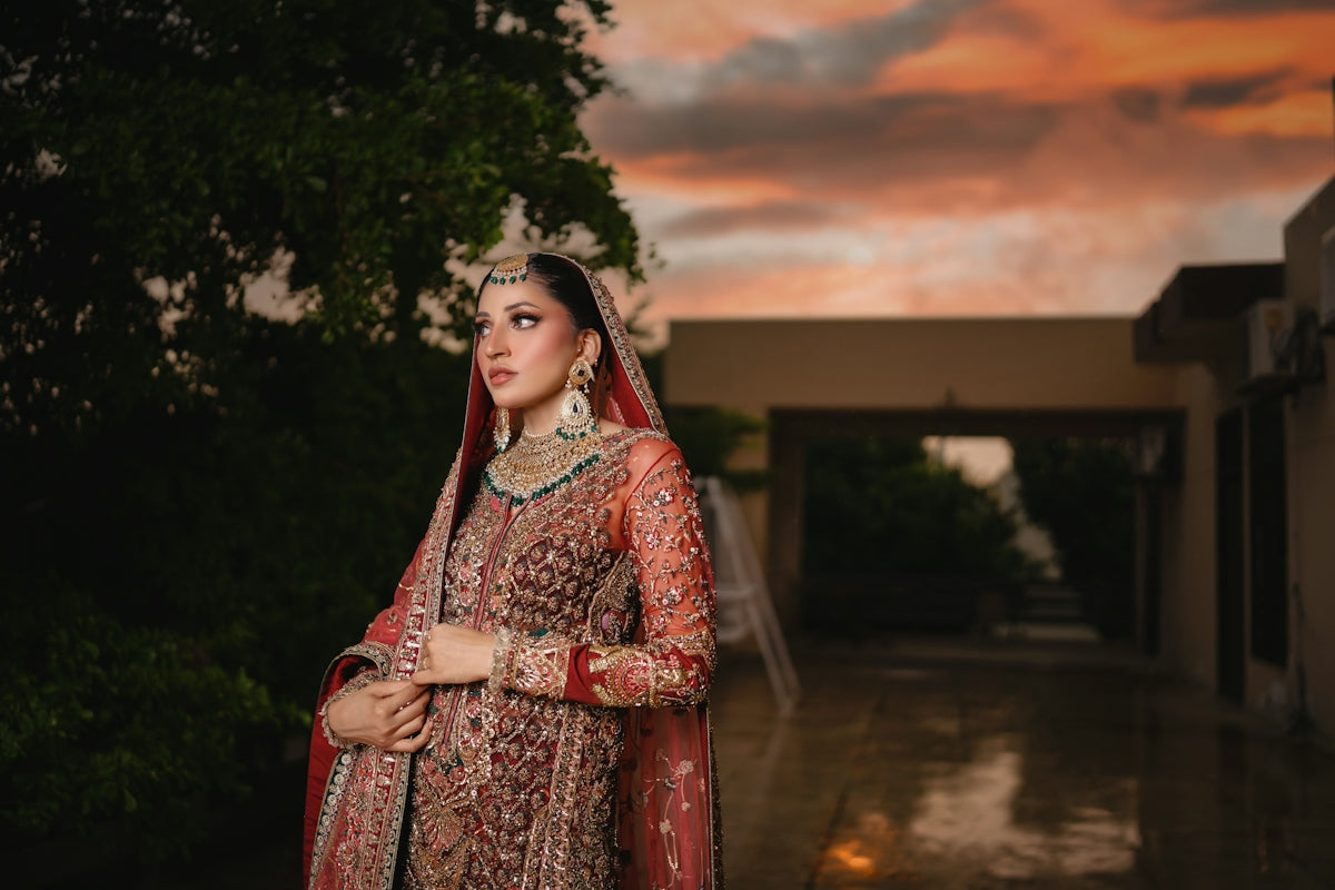 A bride poses in her wedding attire